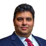 Professional portrait of Dr. Amit K. Sharma, MD, a medical doctor providing expert healthcare services in Beaumont and Houston