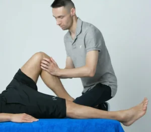 A doctor checking the knee pain of patient