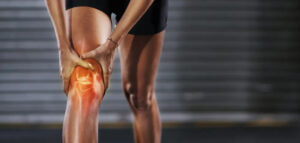 Illustration of a man with a knee injury, showing red muscles and body strain, with focus on the injured leg. Depicts sports-related emergency, workout accident, arthritis, and orthopedic treatment, including first aid for the wound